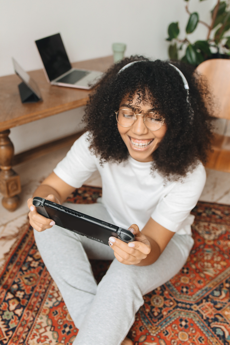 A Woman Enjoying Playing Nintendo Switch